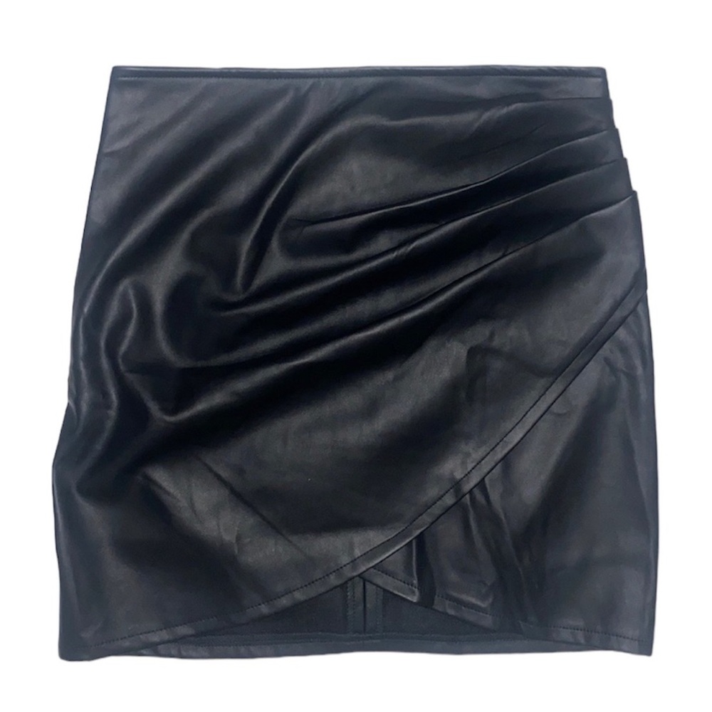 Mini black faux leather skirt with soft lining and side pleating.